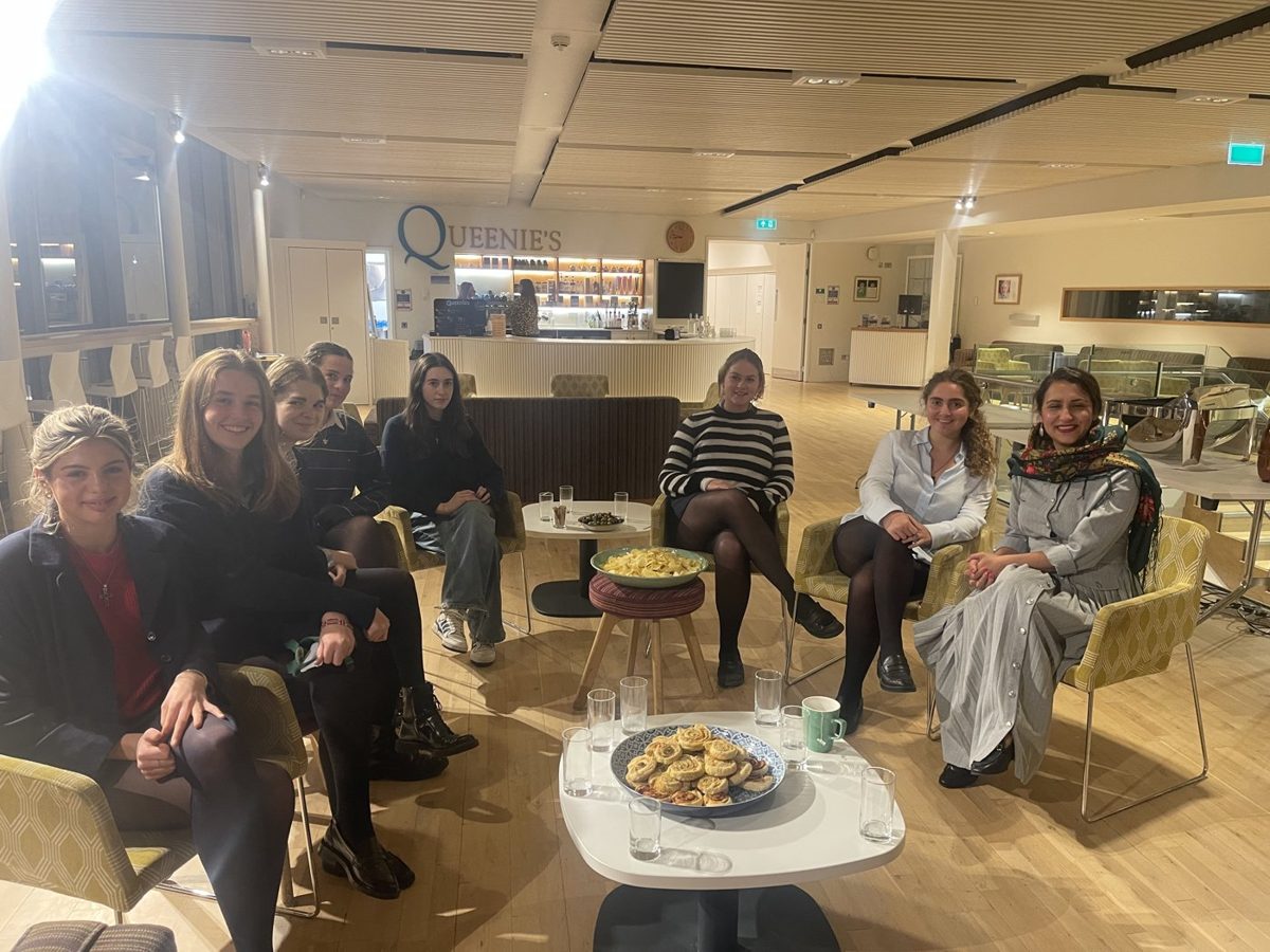 Freshta Karim in a small-group leadership conversation over tea with students at Sherborne Girls
